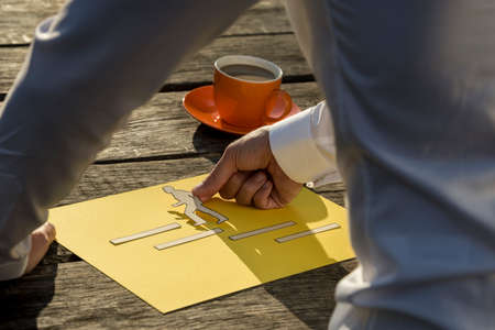 Close-up of the hand of a man making a creative inspirational presentation of a man climbing stairs...