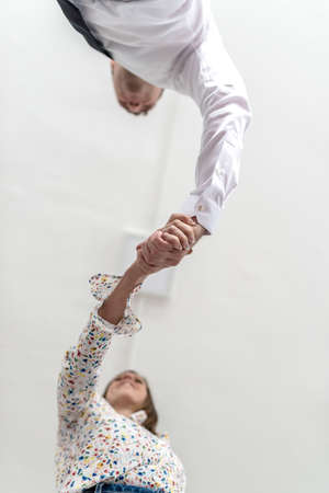Bottom view of a handshake of a businessman and woman conceptual of a business agreement or...