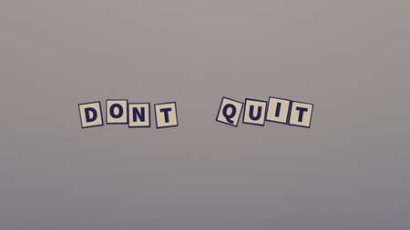 Retro vintage style image of a Dont quit sign with paper letters over grey background.の写真素材