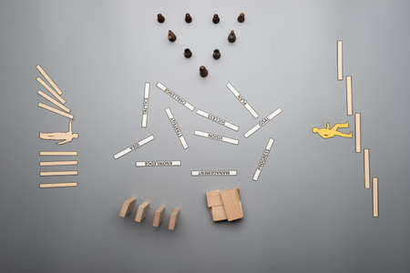 Business strategy and vision concept with wooden blocks, chess figures and words of advancement lying on grey desk.の写真素材