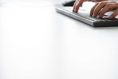 Businessman typing on computer keyboard. With copy space ready for your text.