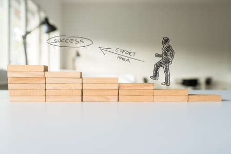 Conceptual image of personal effort it takes to become successful in business - shape of a...