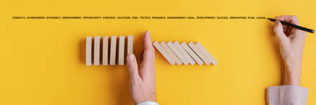 Female hand writing word of business development and success above a businessman stopping falling...