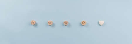 Wide view image of four stars and a heart shape as the fifth  in conceptual image of customer satisfaction, evaluation and feedback.の写真素材