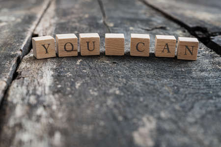 Wooden blocsks placed in a row spelling a You can sign.の写真素材
