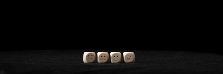 Customer service review and feedback conceptual image - four wooden blocks with smiling, sad and...