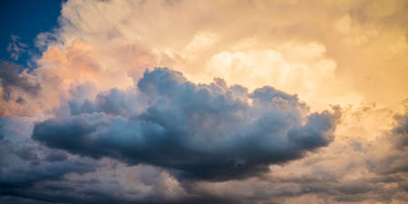 Beautiful majestic cloudscape of various colors at sunset.