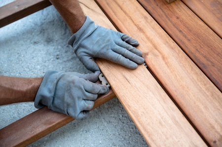 Hand placing wood flooring on the floor.の写真素材