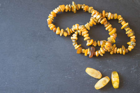 Amber.  Beads from amber. Amber necklace on stone backgroundの写真素材