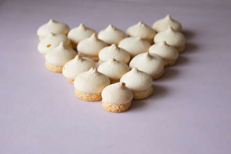 Symbol heart from cookies. Pink backgroundの写真素材