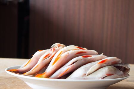 Peeled river fish for soup. Winter fishing. Wooden boardの写真素材