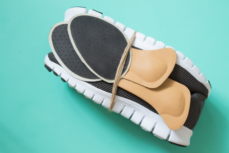 Running shoes with orthopedic insoles. For sport and fitness. Neutral background. Top view.の写真素材