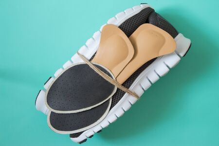 Running shoes with orthopedic insoles. For sport and fitness. Neutral background. Top view.の写真素材