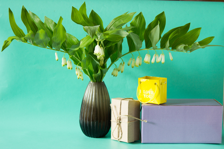 Solomon's seal (Polygonatum multiflorum) in a vase. Bouquet of  spring flowers. Romantic gift. Neutral background.の写真素材