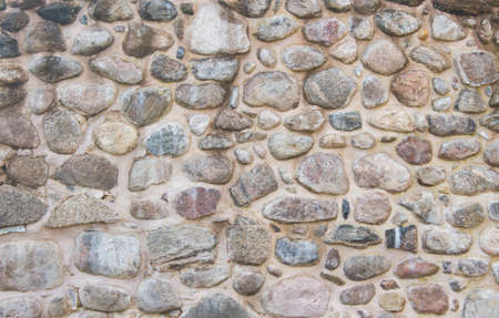 Ancient fortress stone wall. Natural background or texture. Front view.の写真素材