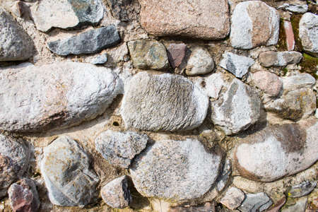 Ancient fortress stone wall. Natural background or texture.の写真素材