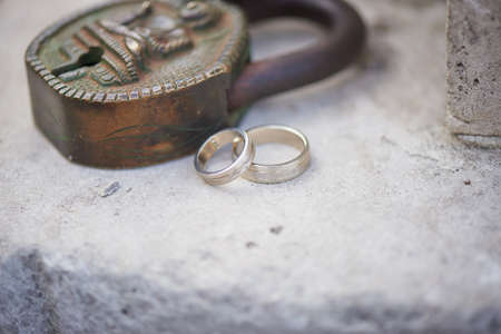 Ancient Indian key lock, green with age with ringsの写真素材