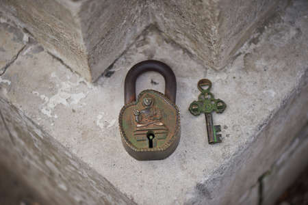 Ancient Indian metal key lock, green with ageの写真素材