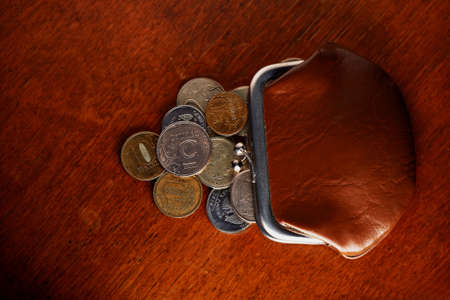 Russian iron coins next to the old walletの写真素材