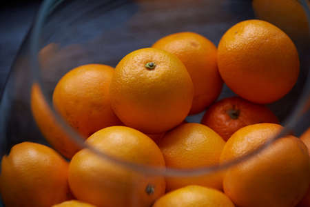 A lot of oranges in a glass bowl