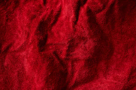 Closeup of crumpled red suede rough finishの写真素材