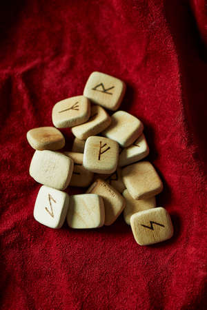 Runes on a background of red rough suede mintの写真素材