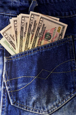 american dollar bills in jeans pocket backgroundの写真素材