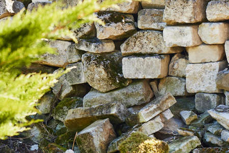 Stone blocks are grey in colour and pile. Background image