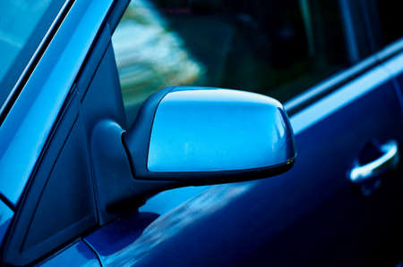 side mirror blue car, the reflection in the glass