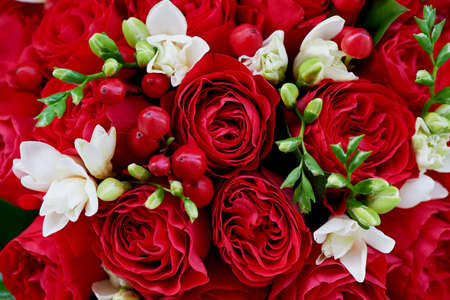 dense red bouquet of roses, with red berries and d cor. Closeの写真素材
