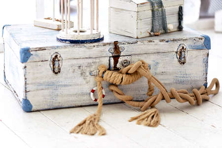 Suitcase in Navy style, with rope tied in a nautical knotの写真素材