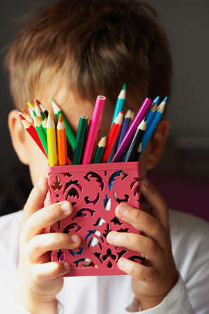 Colored pencils in children's hands, sharpened . Macroの写真素材