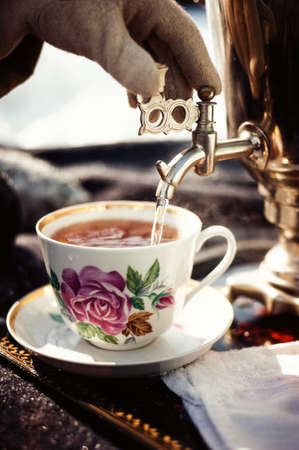 Russian samovar with bagels and jam. Tea party outdoors. Retroの写真素材