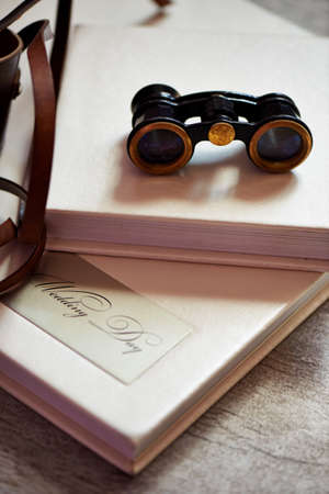 Photobook in bright skin. And vintage binocularsの写真素材