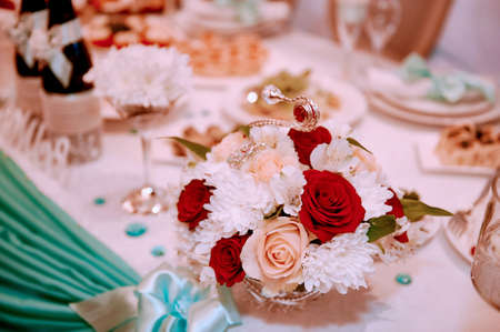 Floral composition on wedding table , red white. Chrysanthemums and roses.の写真素材