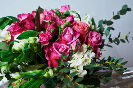 Bouquet of pink roses, white flowers and greenery. Closeの写真素材