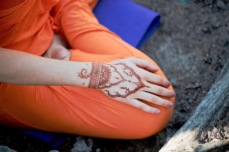 Hand yoga with brown henna mehendi. Harmony and tranquilityの写真素材