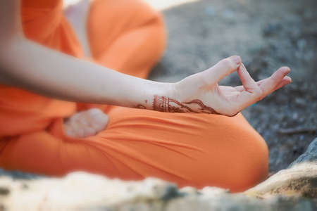 Hand yoga with brown henna mehendi. Harmony and tranquilityの写真素材