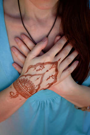 Hand yoga with brown henna mehendi. Harmony and tranquilityの写真素材