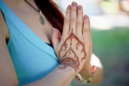 Hand yoga with brown henna mehendi. Harmony and tranquilityの写真素材