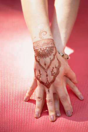 Hand yoga with brown henna mehendi. Harmony and tranquilityの写真素材