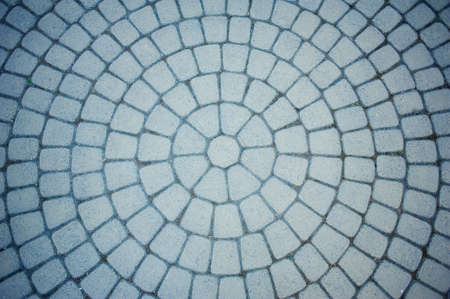 Texture. Pavement paved with stone in a circle. The gray, old townの写真素材