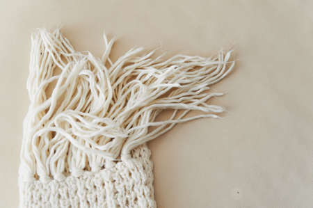 warm White knit scarf with tassels. Closeの写真素材