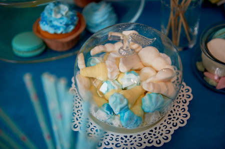 Sweet table for childrens birthday party in turquoise and purple. A sense of celebration, of joy. Beautiful sweetsの写真素材