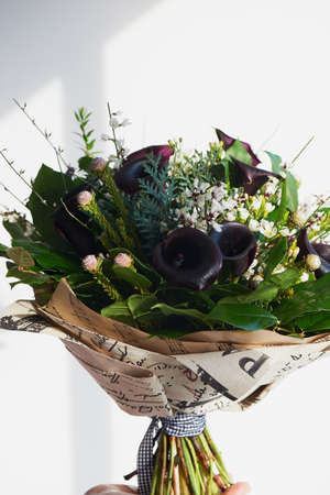 A bouquet of dark noble cal with frosted flower.の写真素材