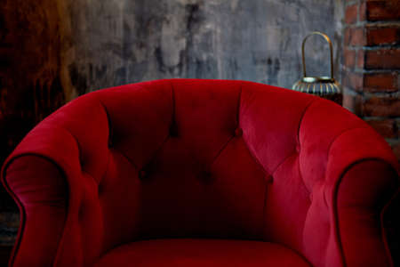 Detail of the red velvet armchairs. Retro furniture. Beautiful and elegantの写真素材