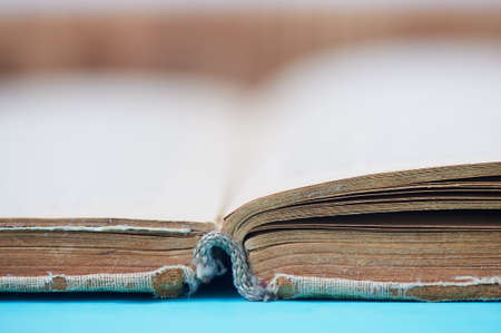 Old worn book in a canvas cover. The symbol of knowledge and learning.Closeの写真素材