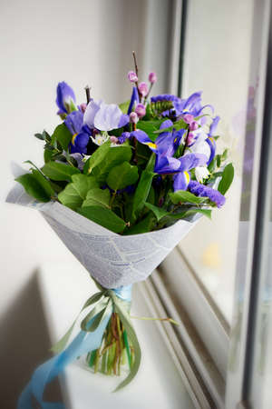 Bouquet of blue irises with Salal and painted willow.Closeの写真素材