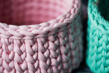 Baskets - turquoise and pink crochet around the circle of knitting yarn, made of cloth.Close