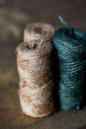 A ball of jute thick threads of brown and green. 3 skeins